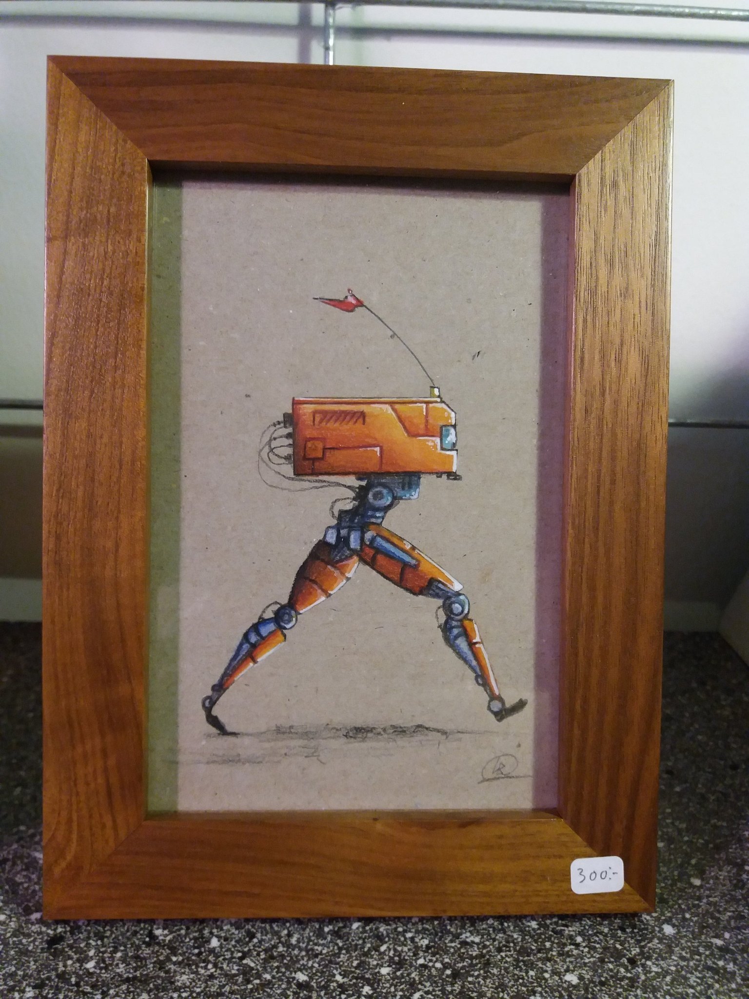 Bild. Orange robot i ram.