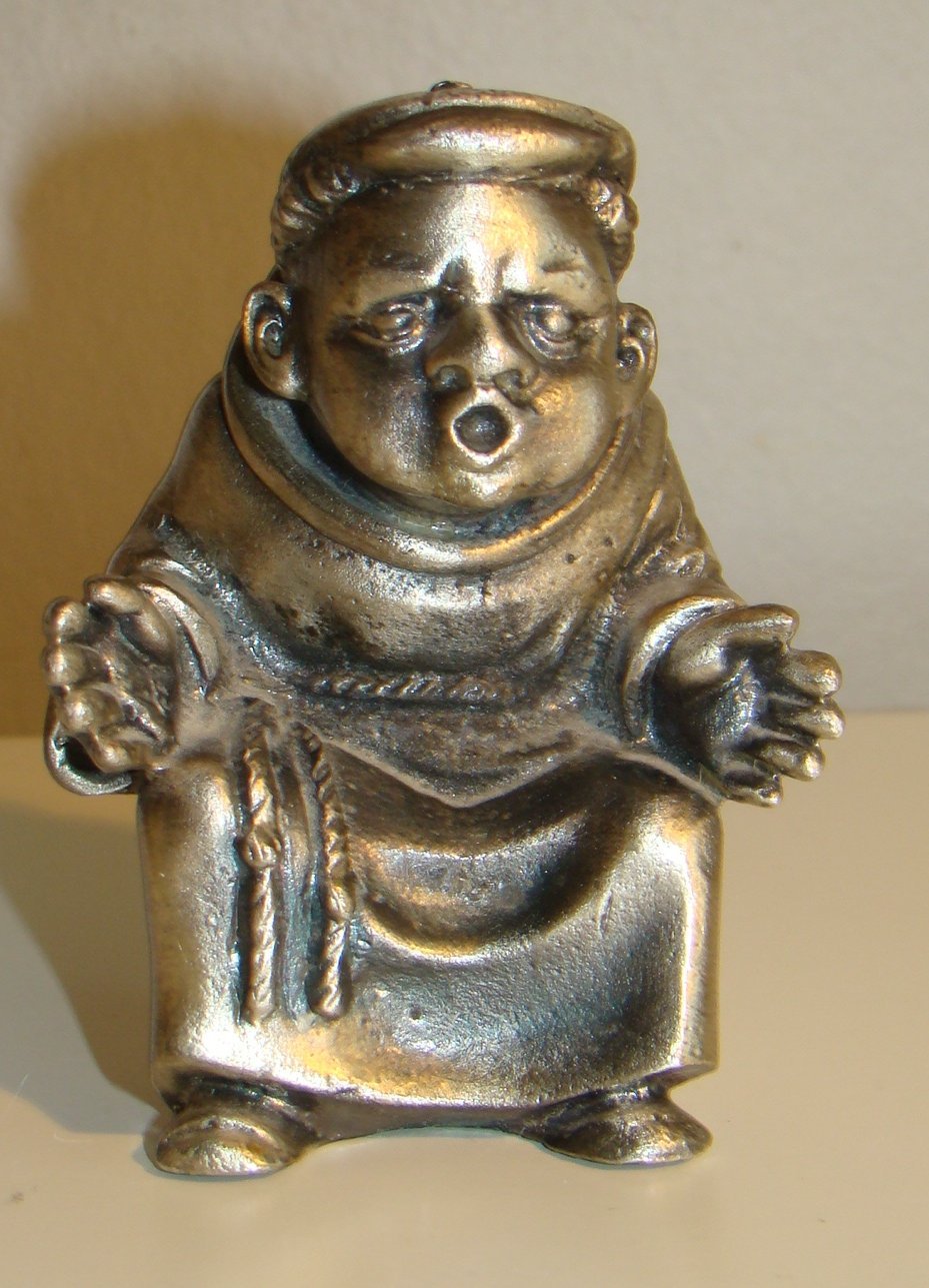 Figur i metall - Sittande man - Papperspress? - Oidentifierad