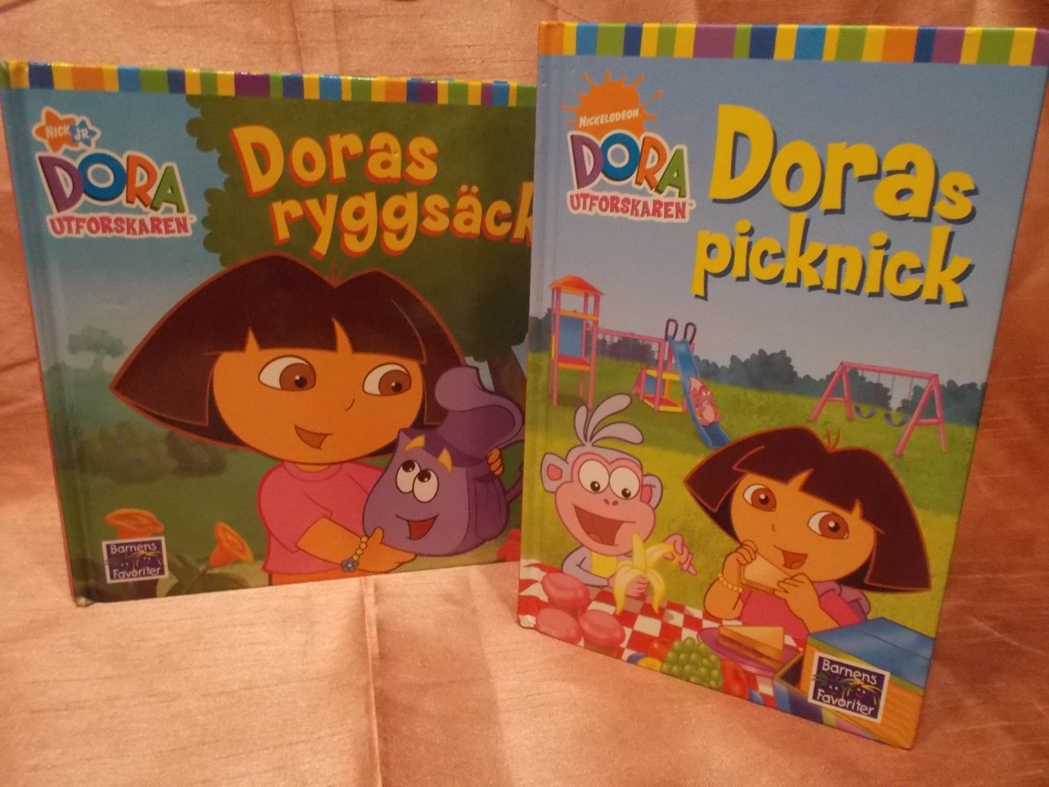 2 st inb böcker med Dora utforskaren. Doras ryg.. (420807946 Dora utforskaren : Doras ryggsäck | Bokbörsen