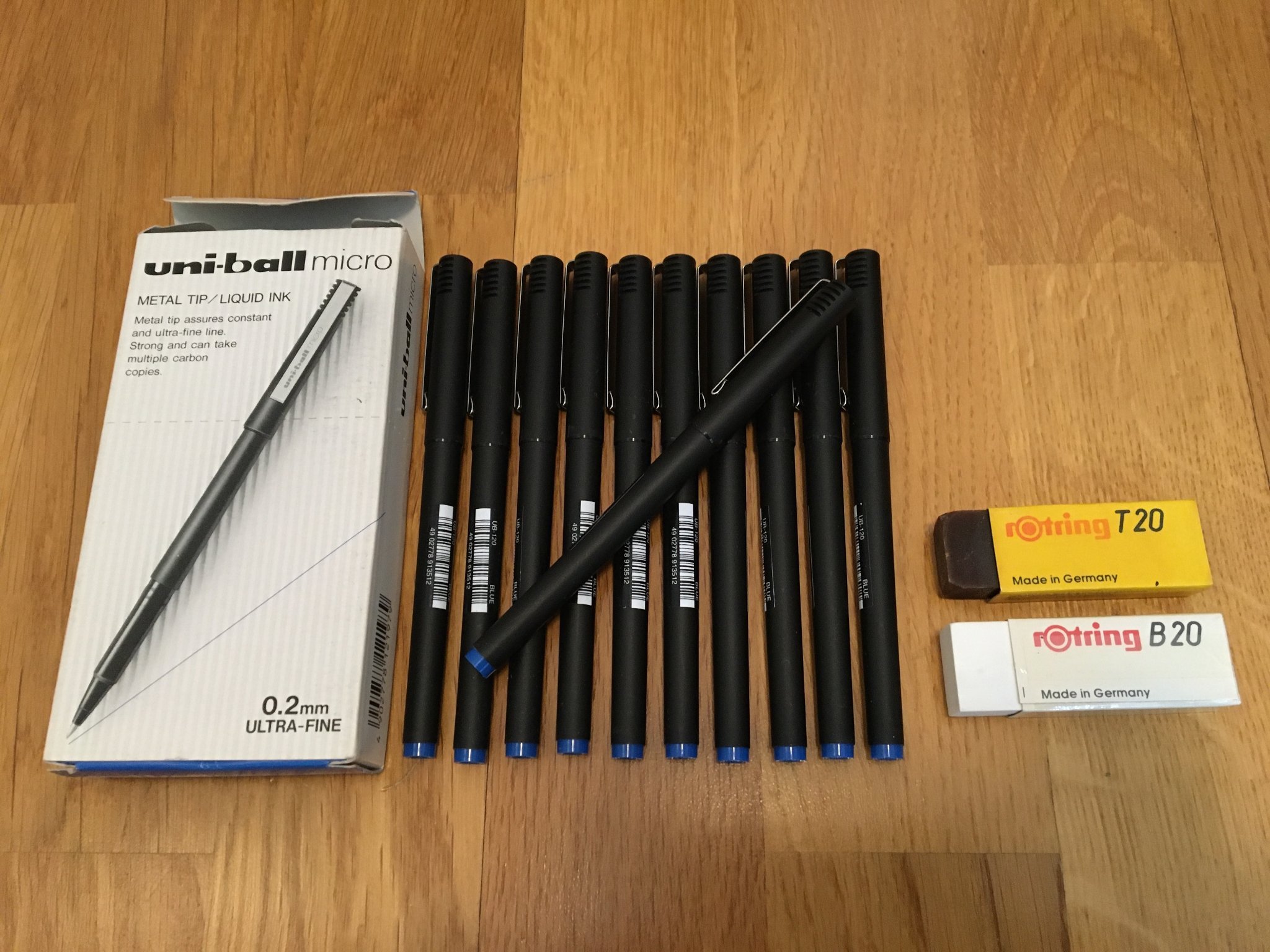 11 st oanvända Uni-ball micro pennor + 2 st radergummin från rotring