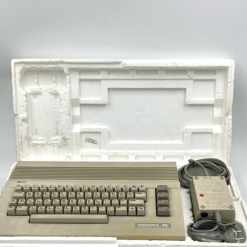 Commodore 64C med originalkartong och nätdel
