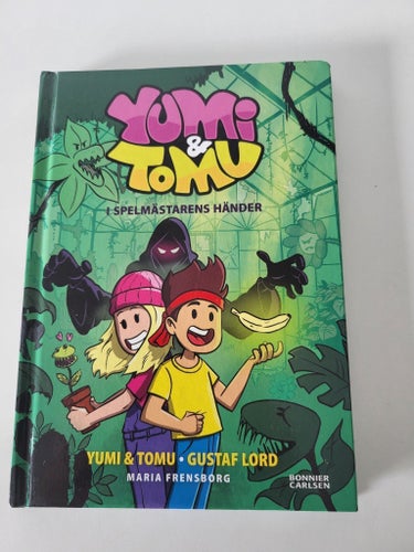 Bok Barnbok Yumi & Tomu I Spelmästarens Händer av Gustaf Lord, Maria Frensberg