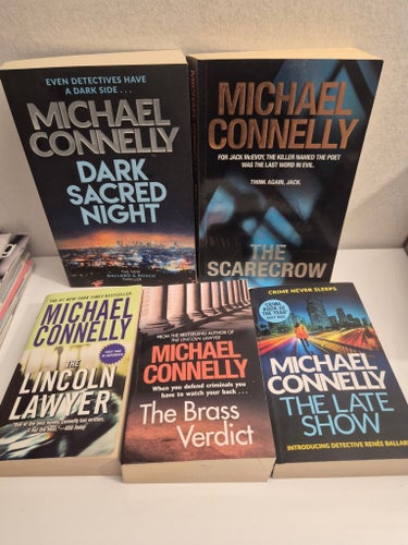 Dark sacred night.The Lincoln lawyer.The scarecrow.The brass verdict.The late sh