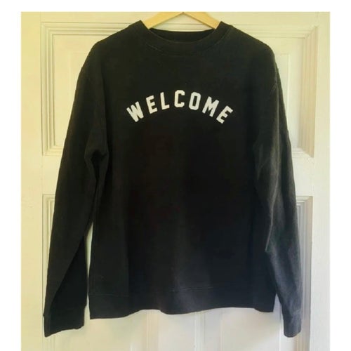 Skatemärket Welcome, Svart sweatshirt, stlk M