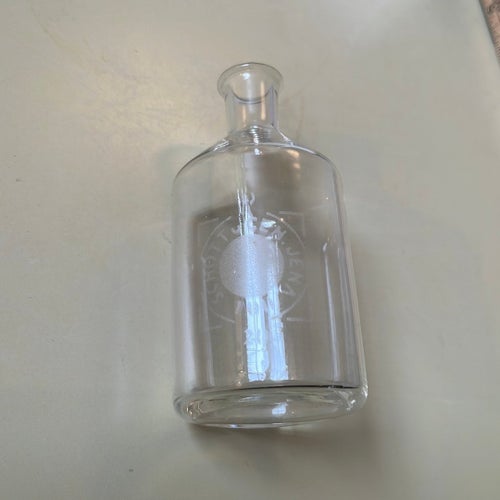 Liten glasflaska märkt SCHOTT & GEN. JENA