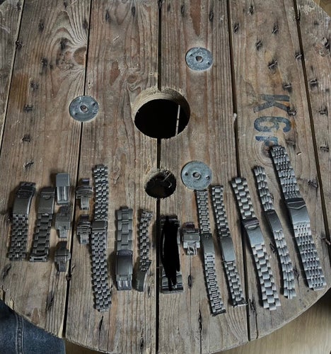 Parti med 11klockarmband i metall från olika märken