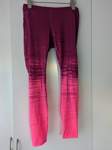 Nya Peak Performance byxor långa träning W lavvutpr rosa mönstrade tights st XL