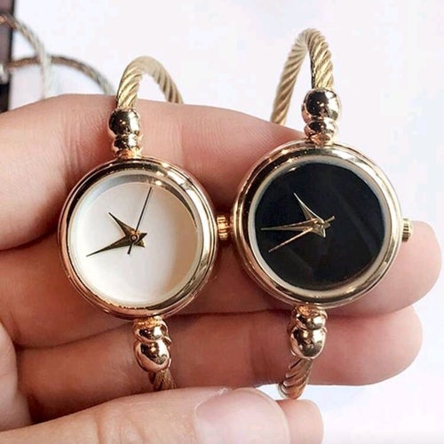 Elegant armbandsur i guldpläterad design med svart eller vit urtavla