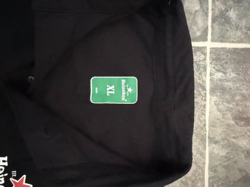 Heineken svart pikétröja, storlek XL
