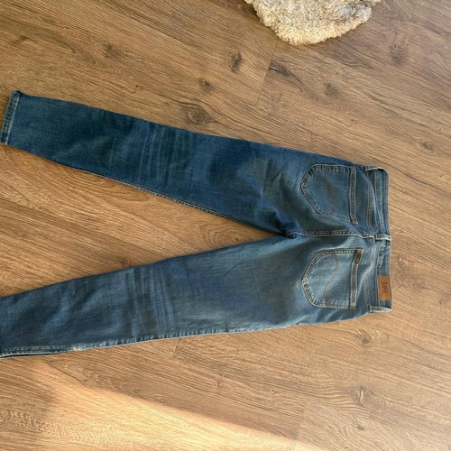Lee blå cropped jeans storlek 27/31