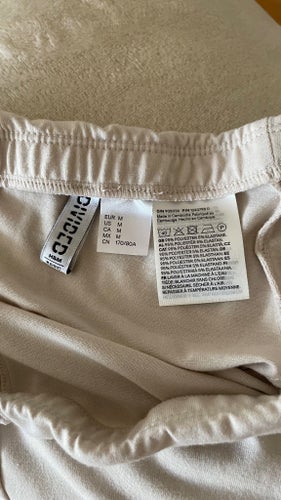 Beige tunn trikot långkjol M. Ny