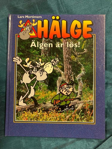 HÄLGE : ÄLGEN ÄR LÖS - SERIEBOK MED HÅRD PÄRM - SAMFRAKTAR