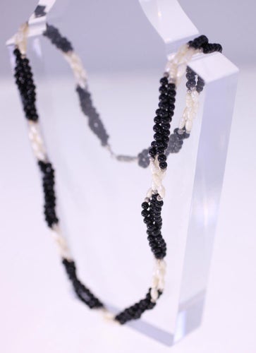 Vintage triple strand white and black plastic bead necklace-metal cylinder clasp