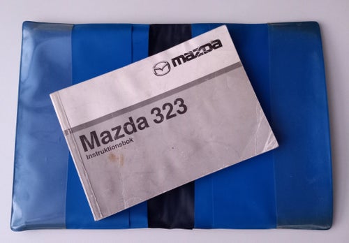 INSTRUKTIONSBOK MAZDA 323