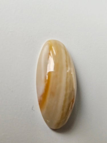 Cabochon av natursten onyx 25 x 11 mm