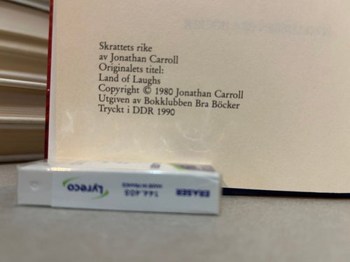 Skrattets Rike av Jonathan Carroll. Bok. Very Fine plus