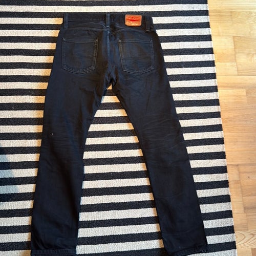 Big John svarta jeans, storlek 32/34