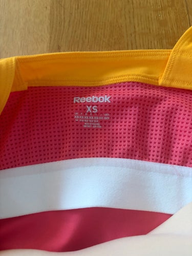 Reebok rosa, gult träningslinne, storlek XS