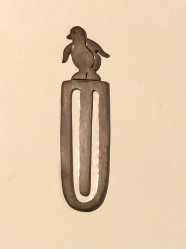 Metal bookmark with penguin