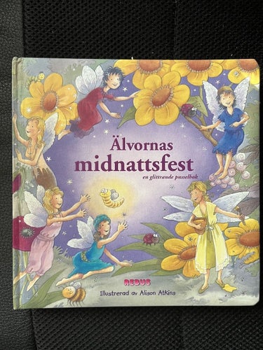 Älvornas midnattsfest. En glittrande pusselbok.