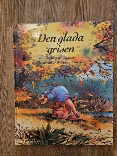 Den glada grisen av Karen Wagner