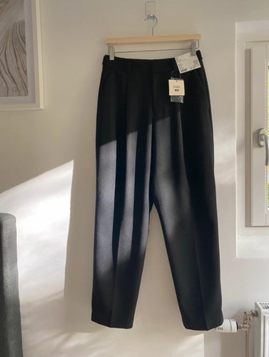 Uniqlo svarta byxor, storlek 27INCH / 68.5CM