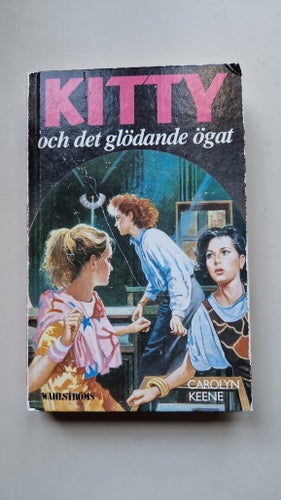 Kitty och det glödande ögat - Carolyn Keene