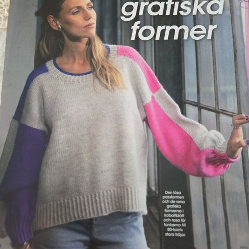 STICKMÖNSTER-PÅ EN FLERFÄRGAD DAMTRÖJA