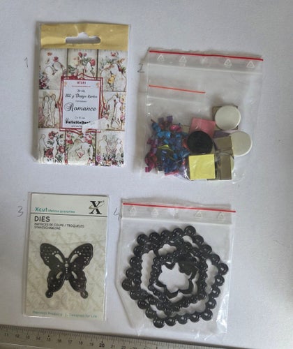 Diecuts, brads, dies I ett paket