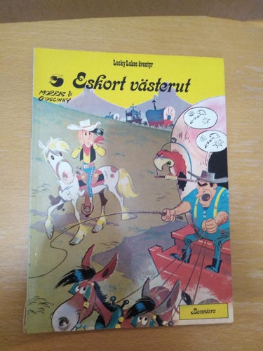 Lucky Lukes äventyr 22 Eskort västerut 1976 första upplagan Very Fine plus