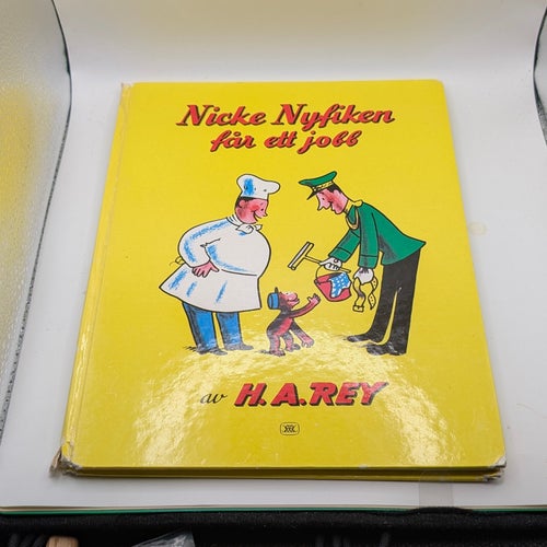 Nicke Nyfiken får ett jobb av H. A. Rey
