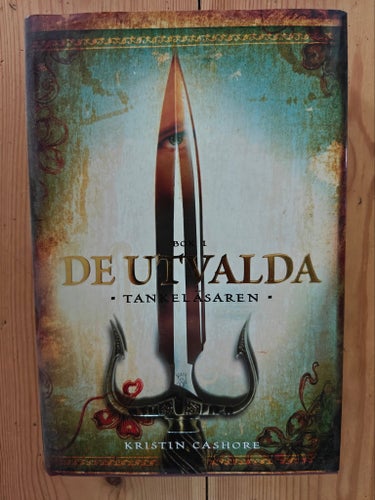 De Utvalda - Tankeläsaren av Kristin Cashore. Bok 1. Förlagsny, inbunden bok!