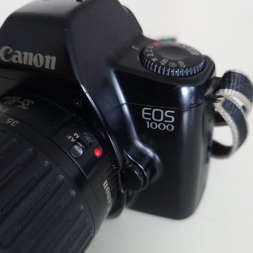 Analog systemkamera Canon EOS 1000 med objektiv