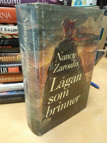 Lågan som brinner av Nancy Zaroulis, bok, inbunden. Very Good plus