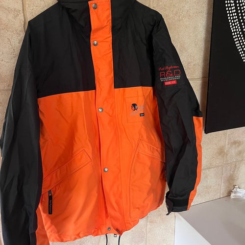 Peak Performance svart, orange jacka