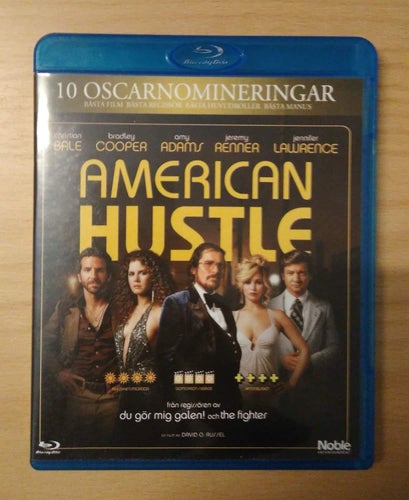 American Hustle av David O Russell med Bradley Cooper och Christian Bale.