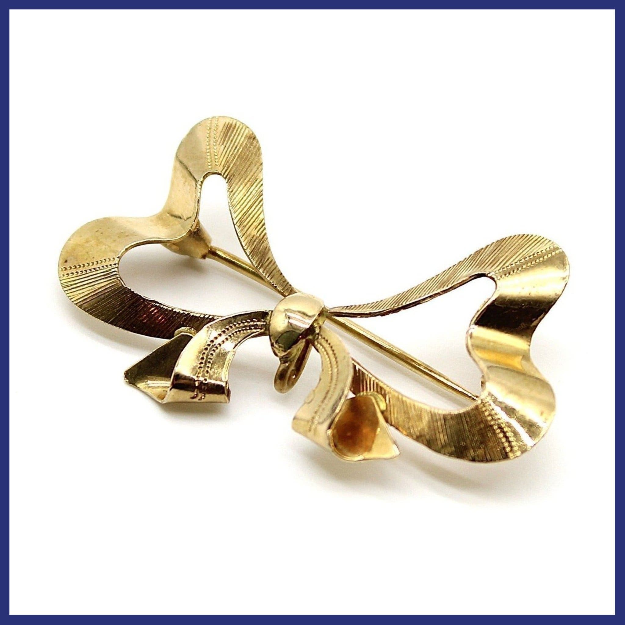 Brosch, 18K guld, rosett (vikt 3,9g)