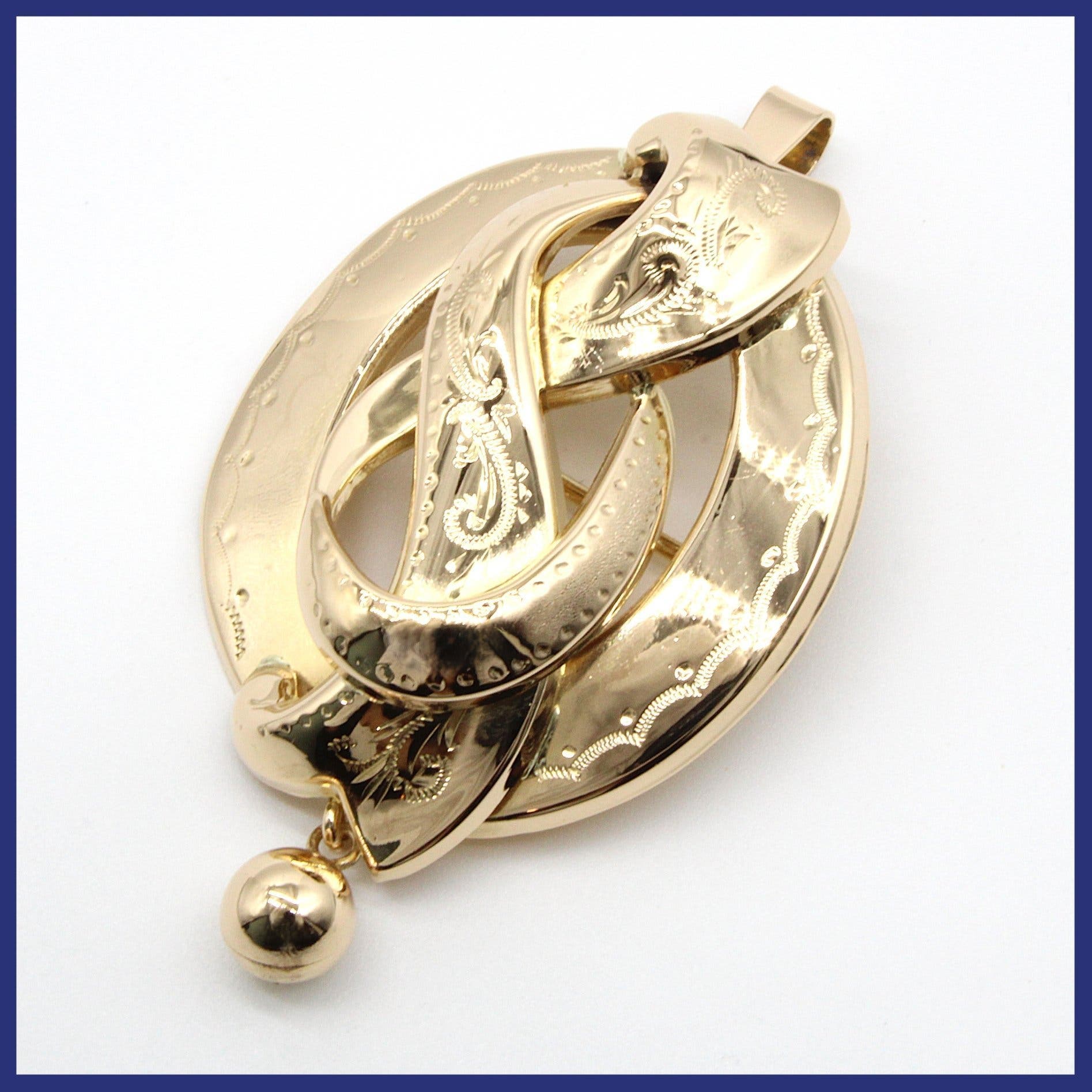 Brosch/hänge, 18K guld, graverat mönster (vikt 7,38g)