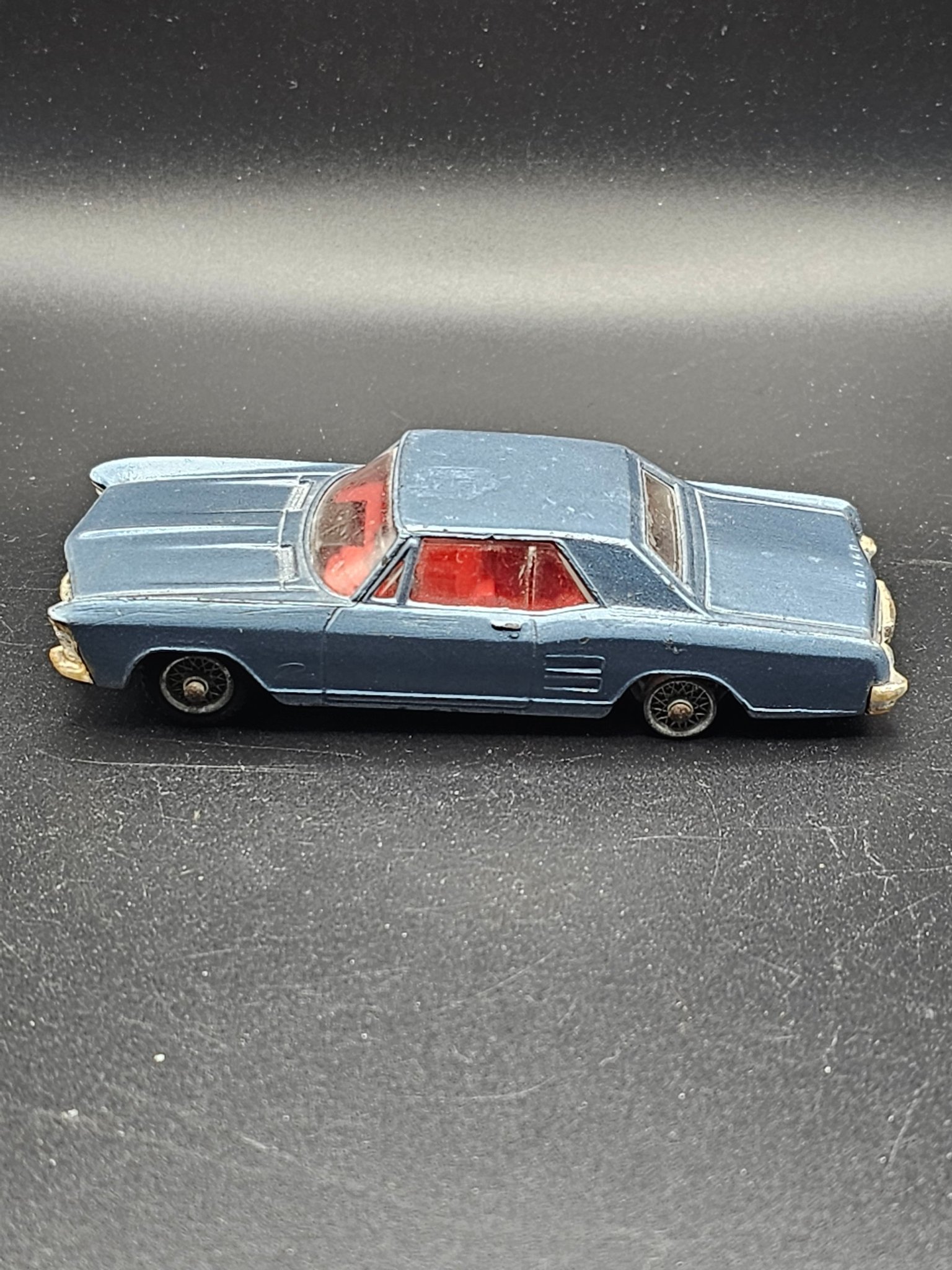 Lot 12 - A CORGI 245 Buick Riviera in metallic gold