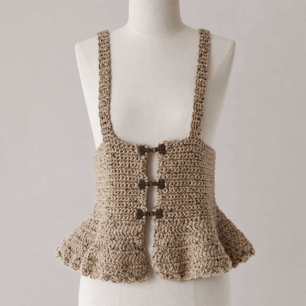 Hand-knitted corset with pewter hooks and underbust design