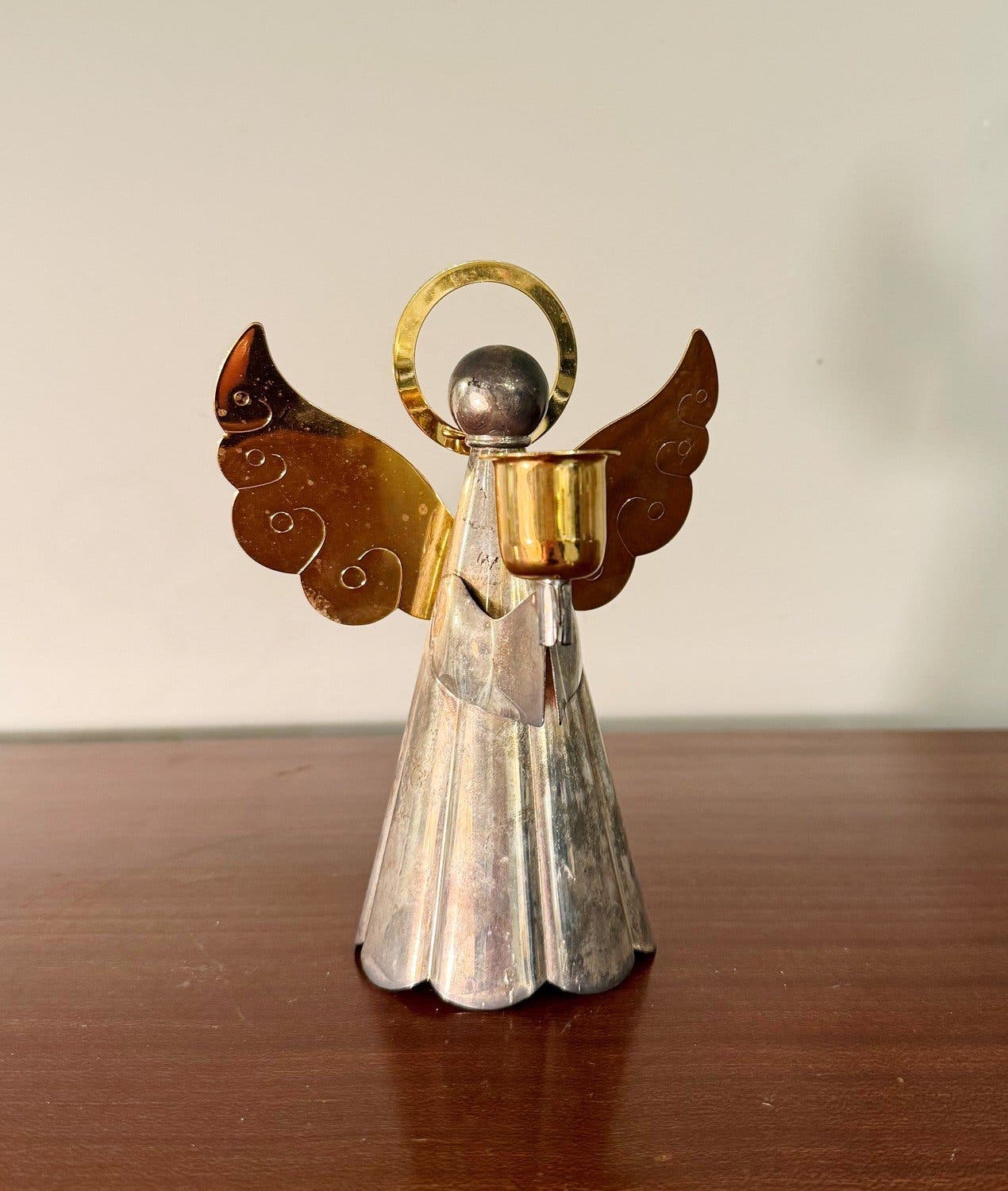 Angel candle holder in silver from Swedish company