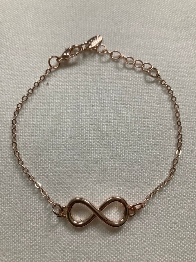 Fint armband evighetssymbol/infinity | Köp på Tradera (715480283)