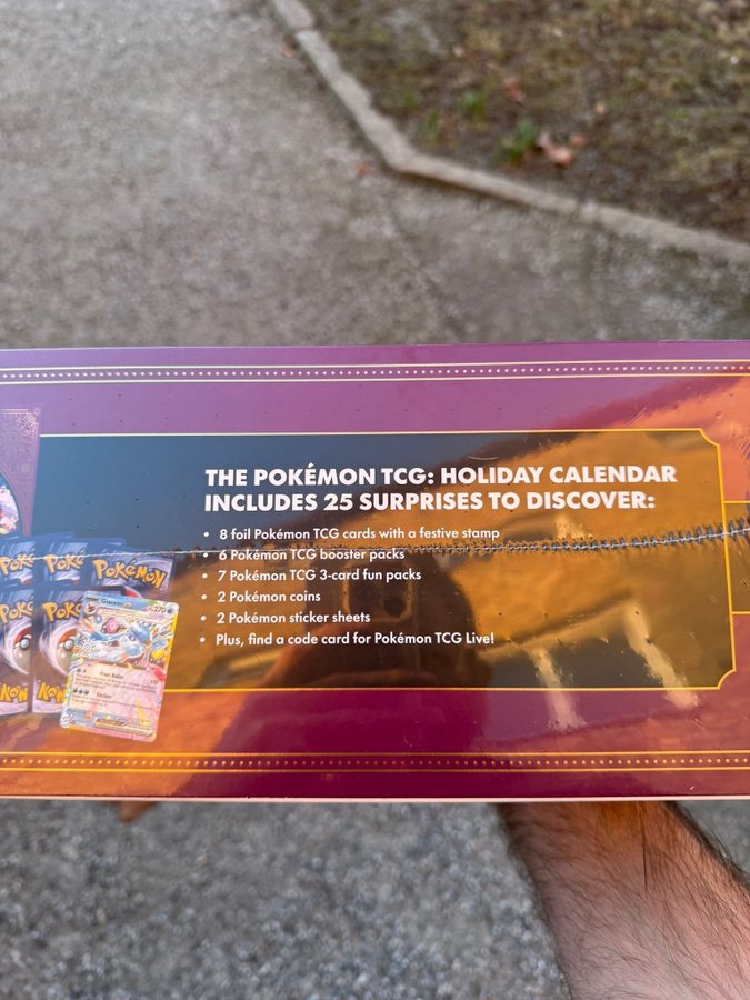 foil pokémon tcg cards with a festive stamp Pokemon 2024 Holiday Calendar