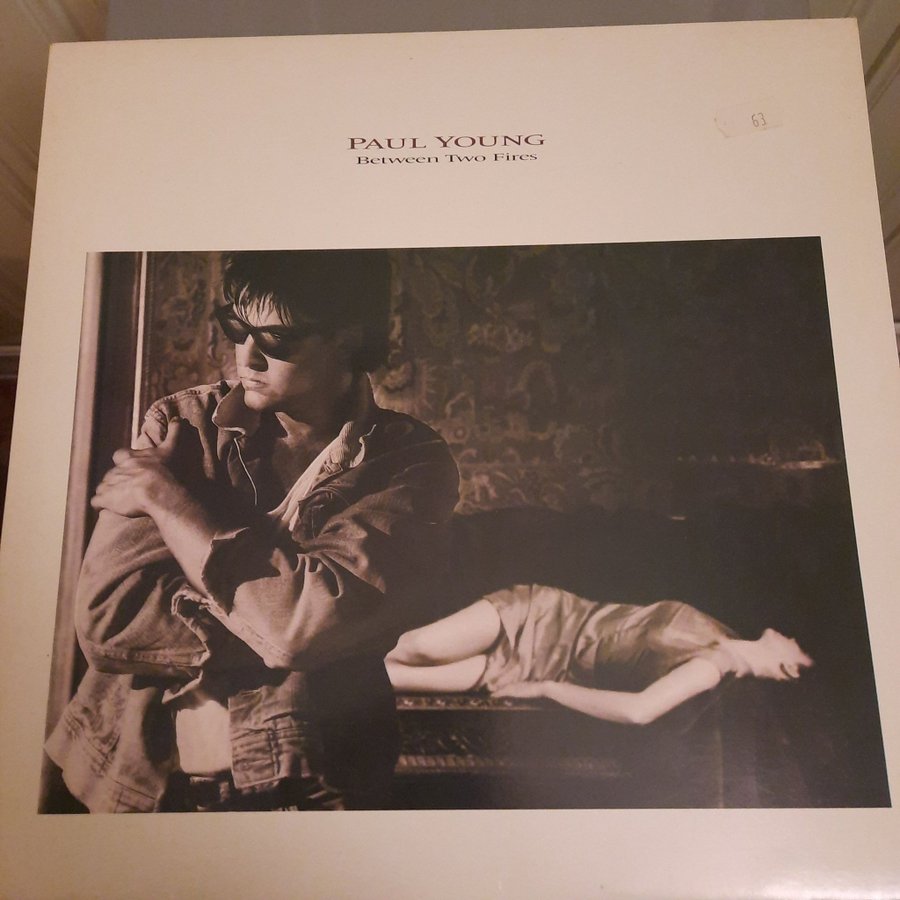 Paul Young - Between Two Fires - LP | Köp på Tradera (711980132)