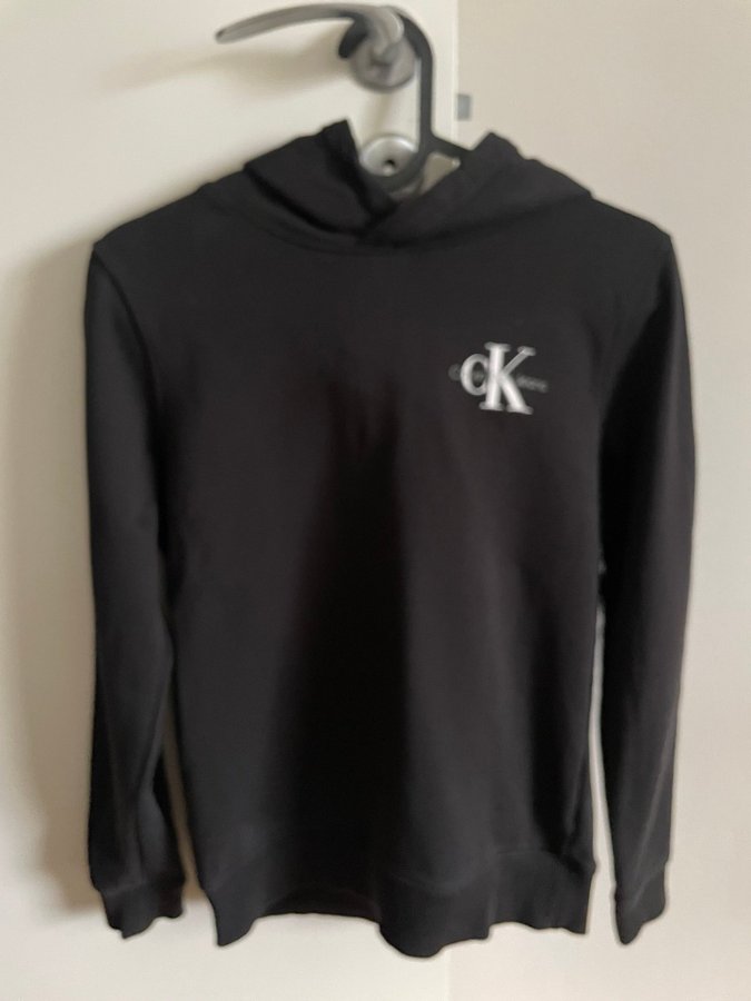 Se produkter som liknar Calvin Klein Jeans hoodie, på Tradera