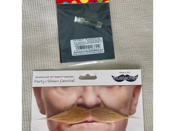 Mustasch lösmustasch obruten förpackning