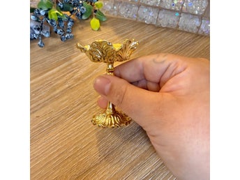 Guldpläterad klothållare
