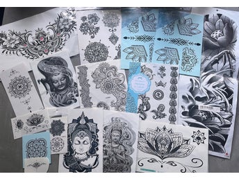 Tillfälliga tatueringar med Buddha, lotus och henna-mönster