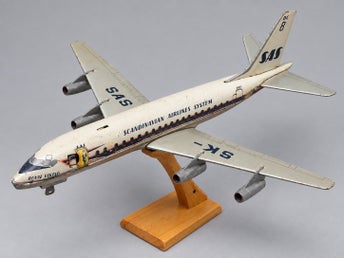 Äldre japanskt modellflygplan/leksaksflygplan föreställande SAS Douglas DC-8 ”Ro