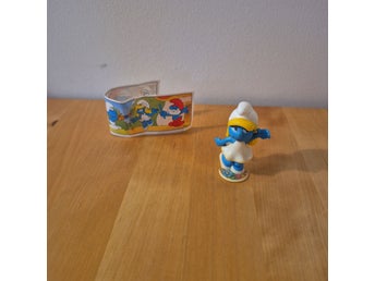 Smurfan figur från Kinderägg med tillhörande bipacksedel